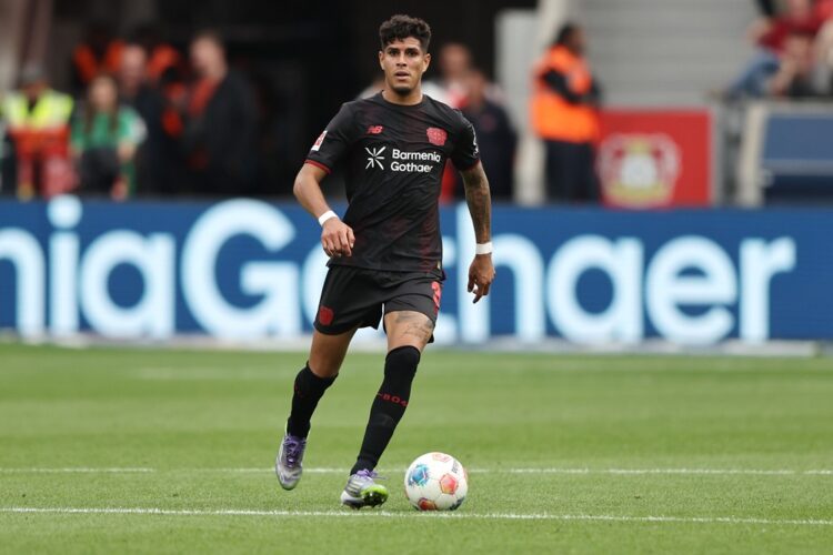LEVERKUSEN, GERMANY: Pierro Hincapie of Bayer 04 Leverkusen runs with the ball during the Bundesliga match between Bayer 04 Leverkusen and TSG Hoff...