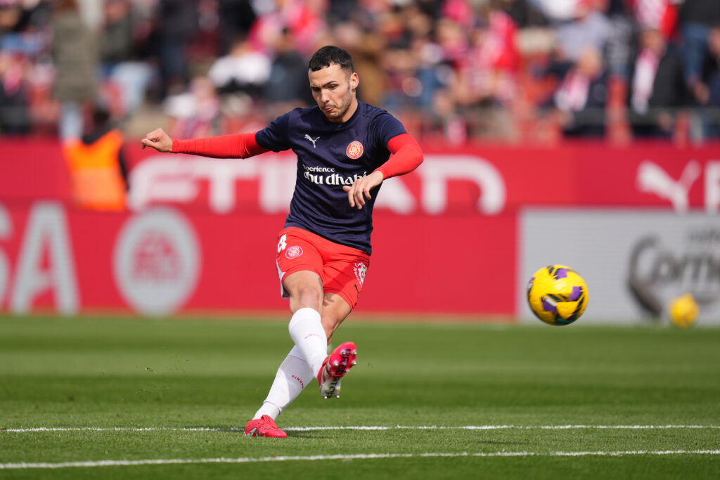 GIRONA, SPAIN - MARCH 01: Arnau Martinez of Girona FC shoots, during the warm up prior to the LaLiga match between Girona FC and RC Celta de Vigo at Montilivi Stadium on March 01, 2025 in Girona, Spain. (Photo by Alex Caparros/Getty Images)
