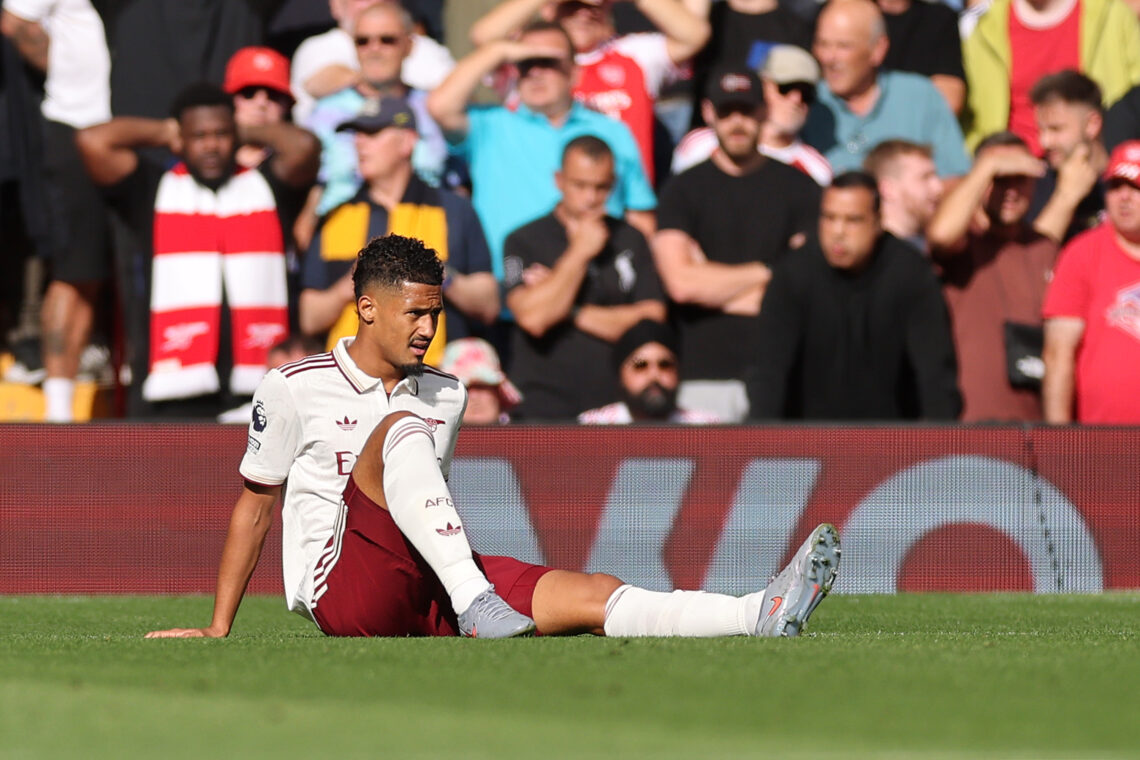 LIVERPOOL, ENGLAND - AUGUST 31: William Saliba of Arsenal reacts with an injury during the Premier League match between Liverpool and Arsenal at An...