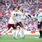 MANCHESTER, ENGLAND - AUGUST 17: Riccardo Calafiori of Arsenal celebrates scoring his team's first goal with teammate Gabriel Martinelli during the Premier League match between Manchester United and Arsenal at Old Trafford on August 17, 2025 in Manchester, England. (Photo by Michael Regan/Getty Images)