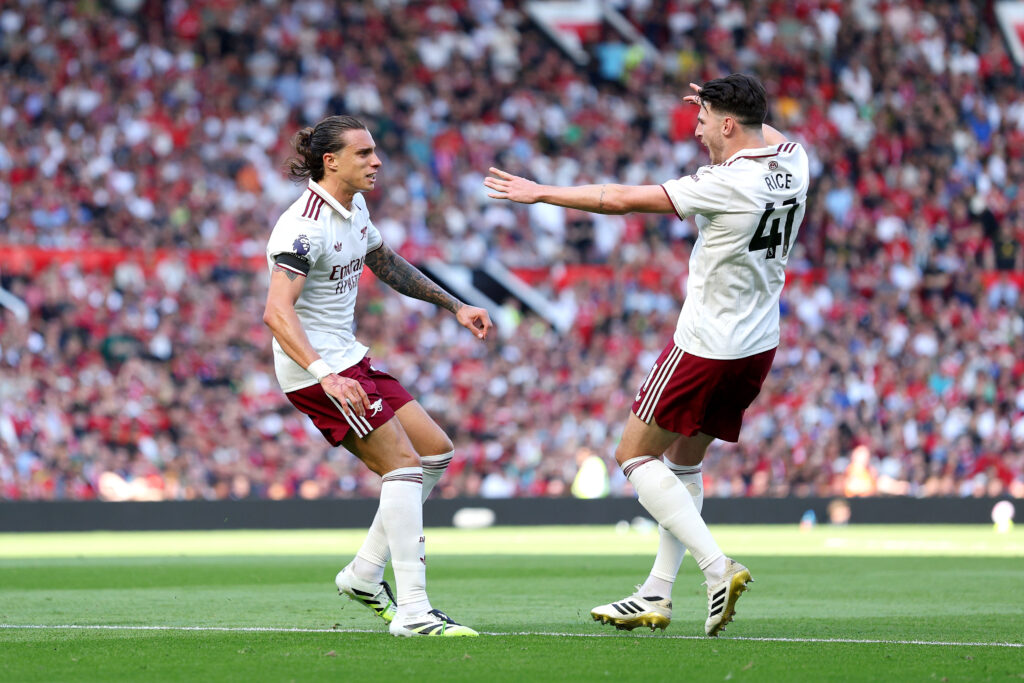 Arsenal scrape Old Trafford win to start title challenge 2 MANCHESTER, ENGLAND - AUGUST 17: Riccardo Calafiori of Arsenal celebrates scoring his team's first goal with teammate Declan Rice during the Premier League match between Manchester United and Arsenal at Old Trafford on August 17, 2025 in Manchester, England. (Photo by Michael Regan/Getty Images)