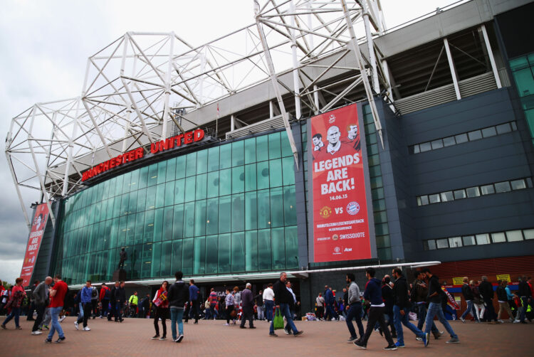 MANCHESTER, ENGLAND - MAY 17: Fans walk outside the stadium prior to the Barclays Premier League match between Manchester United and Arsenal at Old...