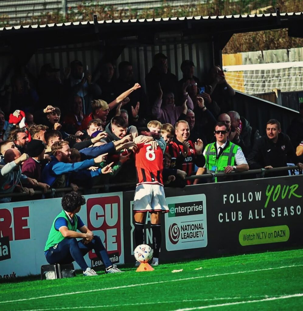 Former Gunner scores wondergoal from 30 yards 3 Miguel Azeez celebrates a goal for Morecambe FC (Photo via Azeez on Instagram)