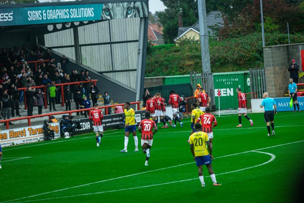 Maldini Kacurri (#5) with Morecambe FC (Photo via Morecambe FC on Instagram)
