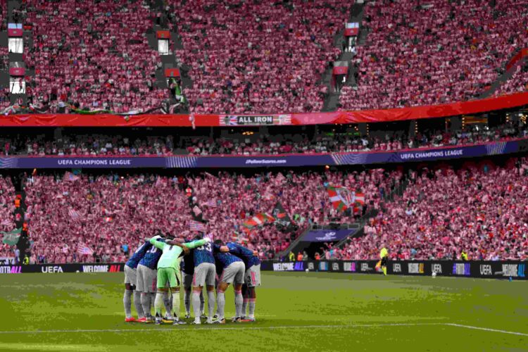 General view inside the stadium as players of Arsenal form a huddle prior to the UEFA Champions League 2025/26 League Phase MD1 match between Athle...