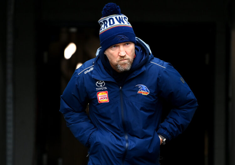 MELBOURNE, AUSTRALIA - JUNE 25: Darren Burgess of the Crows walks out onto the field during the round 15 AFL match between Collingwood Magpies and ...
