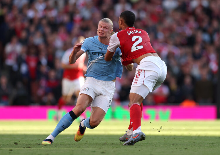 LONDON, ENGLAND - SEPTEMBER 21: Erling Haaland of Manchester City and William Saliba of Arsenal battle for position during the Premier League match...