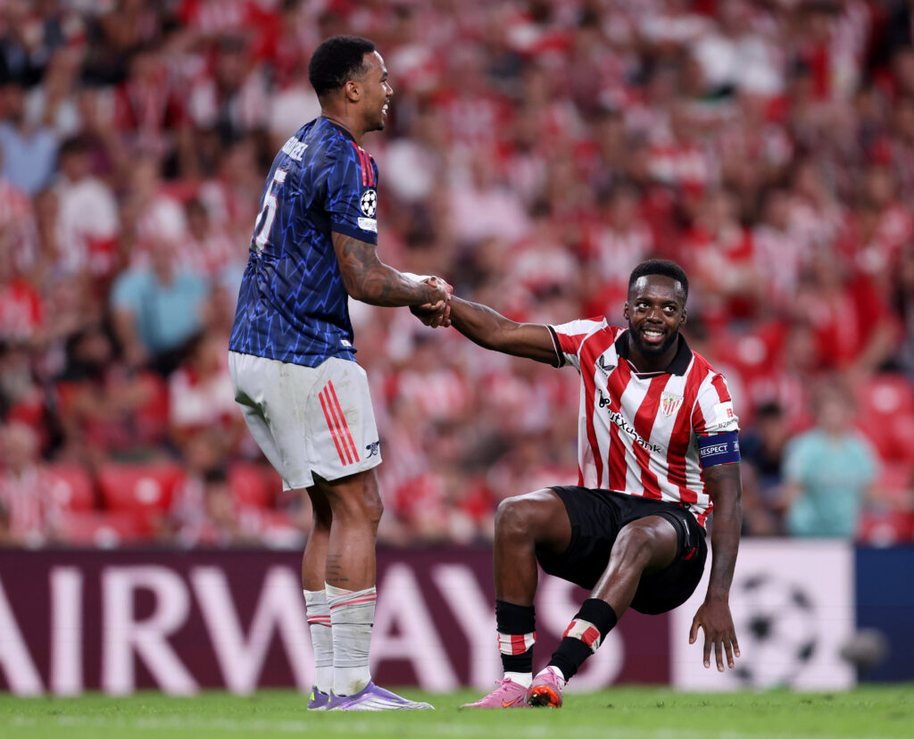 BILBAO, SPAIN - SEPTEMBER 16: Inaki Williams of Athletic Club is helped up by Gabriel of Arsenal during the UEFA Champions League 2025/26 League Phase MD1 match between Athletic Club and Arsenal FC at Estadio de San Mames on September 16, 2025 in Bilbao, Spain. (Photo by Ion Alcoba Beitia/Getty Images)