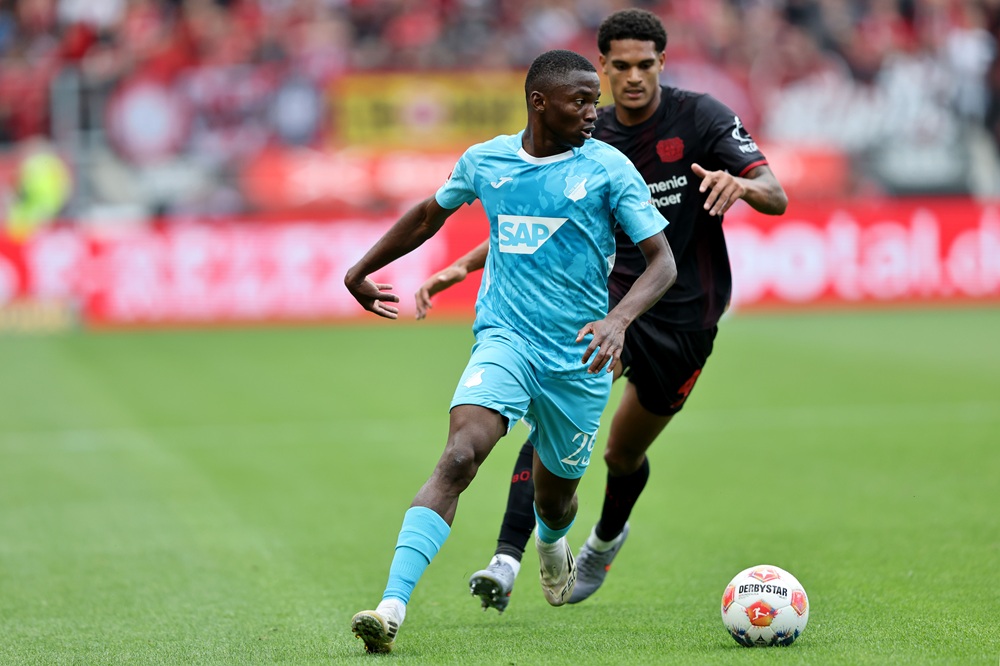 LEVERKUSEN, GERMANY: Bazoumana Toure of TSG 1899 Hoffenheim runs with the ball during the Bundesliga match between Bayer 04 Leverkusen and TSG Hoffenheim at BayArena on August 23, 2025. (Photo by Christof Koepsel/Getty Images)
