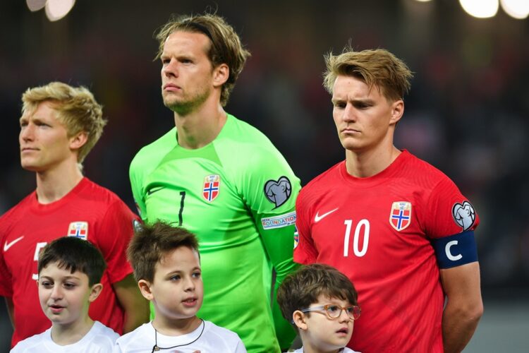 BATUMI, GEORGIA: Birger Meling, Orjan Nyland and Martin Odegaard, the captain of Norway, stand for the anthems during the UEFA EURO 2024 qualifying...