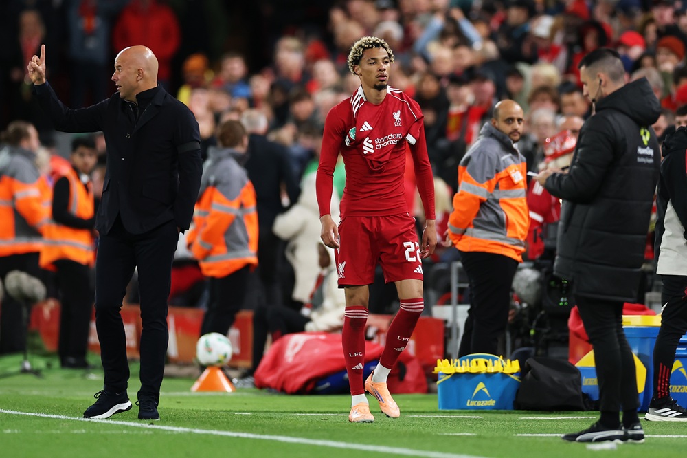 LIVERPOOL, ENGLAND: Arne Slot, Manager of Liverpool, gestures as Hugo Ekitike of Liverpool leaves the field after receiving a second yellow card from Referee Thomas Bramall (not pictured) for celebrating scoring his team's second goal by removing his match shirt during the Carabao Cup Third Round match between Liverpool and Southampton at Anfield on September 23, 2025. (Photo by Stu Forster/Getty Images)