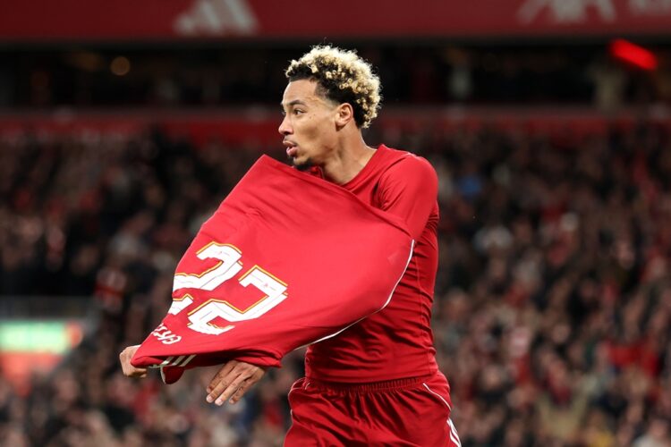 LIVERPOOL, ENGLAND: Hugo Ekitike of Liverpool celebrates scoring his team's second goal by removing his match shirt and subsequently receives a sec...