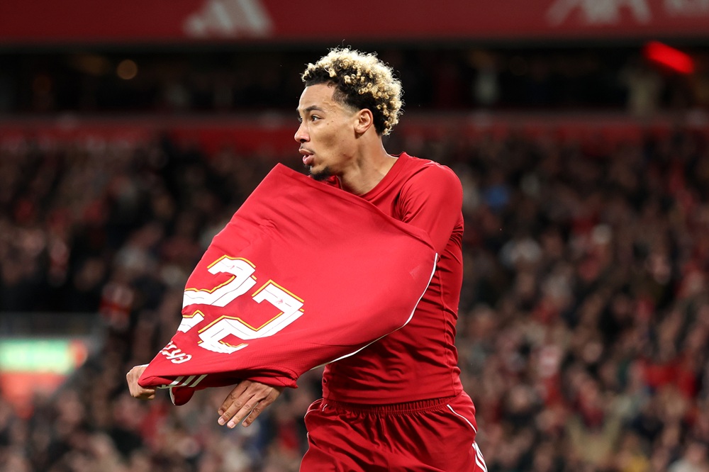 LIVERPOOL, ENGLAND: Hugo Ekitike of Liverpool celebrates scoring his team's second goal by removing his match shirt and subsequently receives a second yellow card from Referee Thomas Bramall (not pictured) to be sent off during the Carabao Cup Third Round match between Liverpool and Southampton at Anfield on September 23, 2025. (Photo by Jan Kruger/Getty Images)