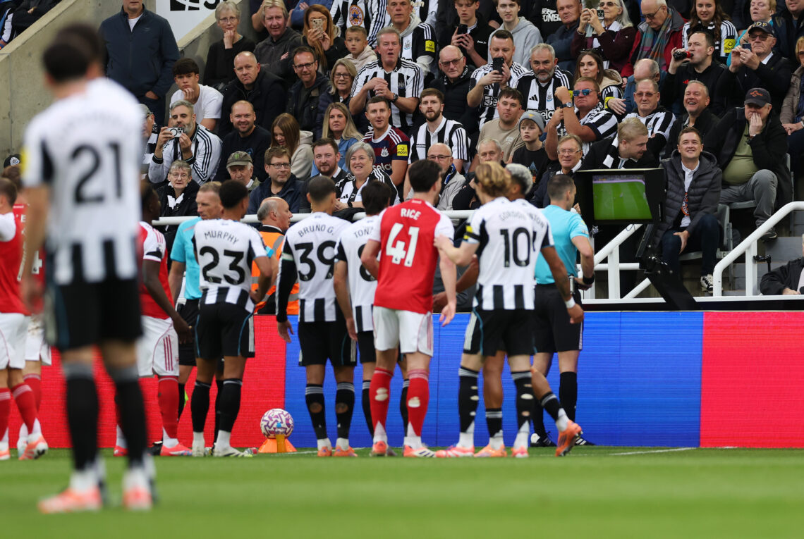 NEWCASTLE UPON TYNE, ENGLAND - SEPTEMBER 28: Fans of Newcastle United watch as referee Jarred Gillett checks the pitchside monitor after a penalty ...