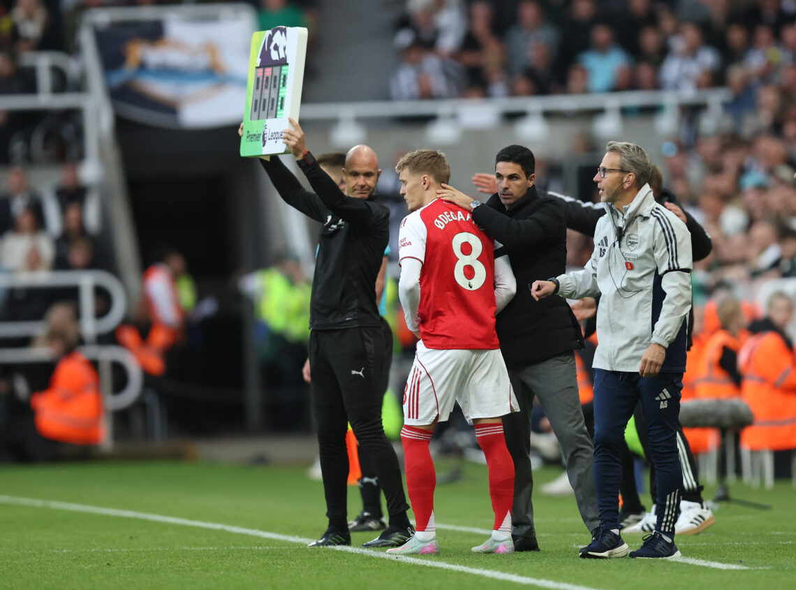 NEWCASTLE UPON TYNE, ENGLAND - SEPTEMBER 28: Martin Odegaard of Arsenal is greeted by Arsenal Head Coach Mikel Arteta as he is brought on during th...
