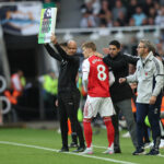 NEWCASTLE UPON TYNE, ENGLAND - SEPTEMBER 28: Martin Odegaard of Arsenal is greeted by Arsenal Head Coach Mikel Arteta as he is brought on during the Premier League match between Newcastle United and Arsenal at St James' Park on September 28, 2025 in Newcastle upon Tyne, England. (Photo by George Wood/Getty Images)