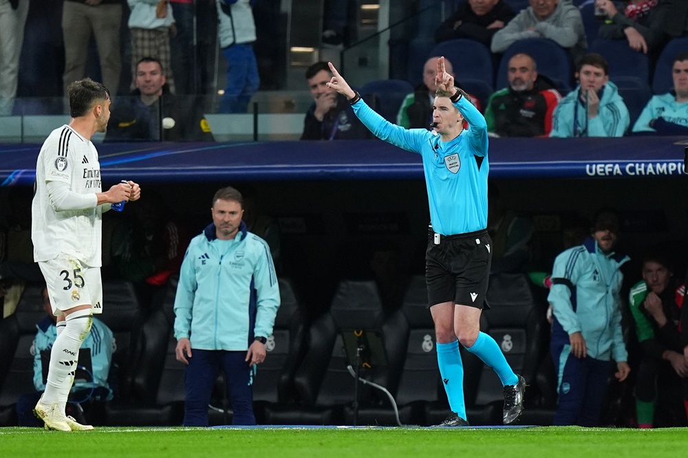MADRID, SPAIN: Referee Francois Letexier gestures to overturn the penalty earlier awarded to Real Madrid following a VAR check during the UEFA Champions League 2024/25 Quarter Final Second Leg match between Real Madrid C.F. and Arsenal FC at Estadio Santiago Bernabeu on April 16, 2025. (Photo by Angel Martinez/Getty Images)