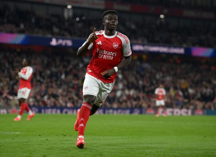 LONDON, ENGLAND: Bukayo Saka of Arsenal celebrates scoring his team's second goal during the UEFA Champions League 2025/26 League Phase MD2 match b...