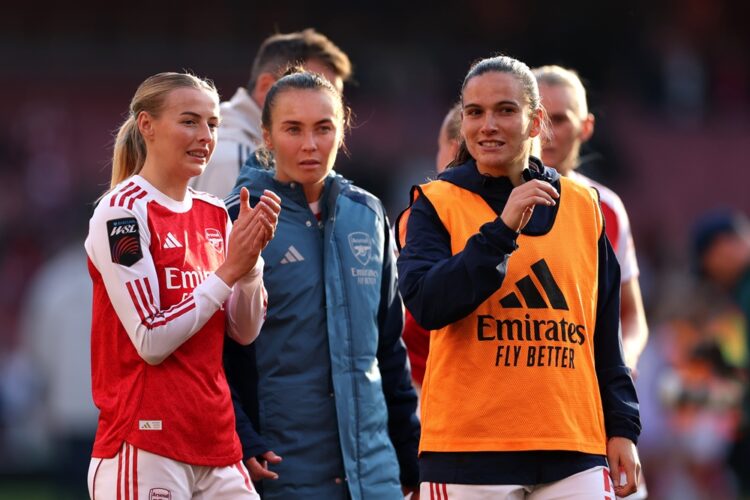 LONDON, ENGLAND: Chloe Kelly of Arsenal applauds the fans with teammates Caitlin Foord and Laia Codina after the team's victory in the Barclays Wom...