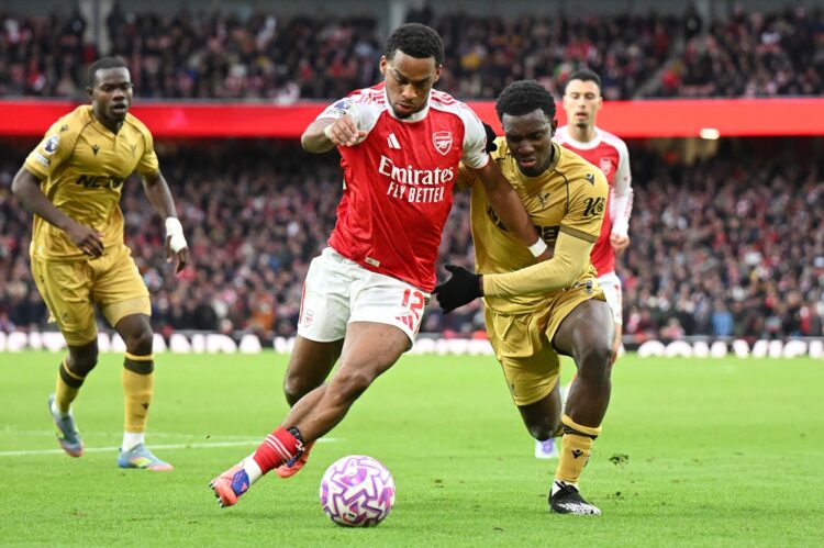 LONDON, ENGLAND: Jurrien Timber of Arsenal battles for possession with Eddie Nketiah of Crystal Palace during the Premier League match between Arse...