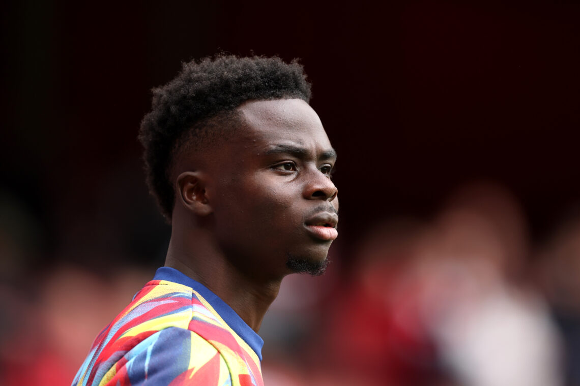 LONDON, ENGLAND - OCTOBER 04: Bukayo Saka of Arsenal looks on as he warms up prior to the Premier League match between Arsenal and West Ham United ...