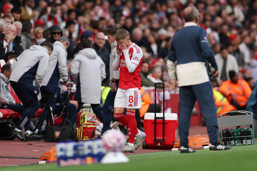 LONDON, ENGLAND - OCTOBER 04: Martin Odegaard of Arsenal looks dejected as he leaves the pitch injured during the Premier League match between Arsenal and West Ham United at Emirates Stadium on October 04, 2025 in London, England. (Photo by Alex Pantling/Getty Images)