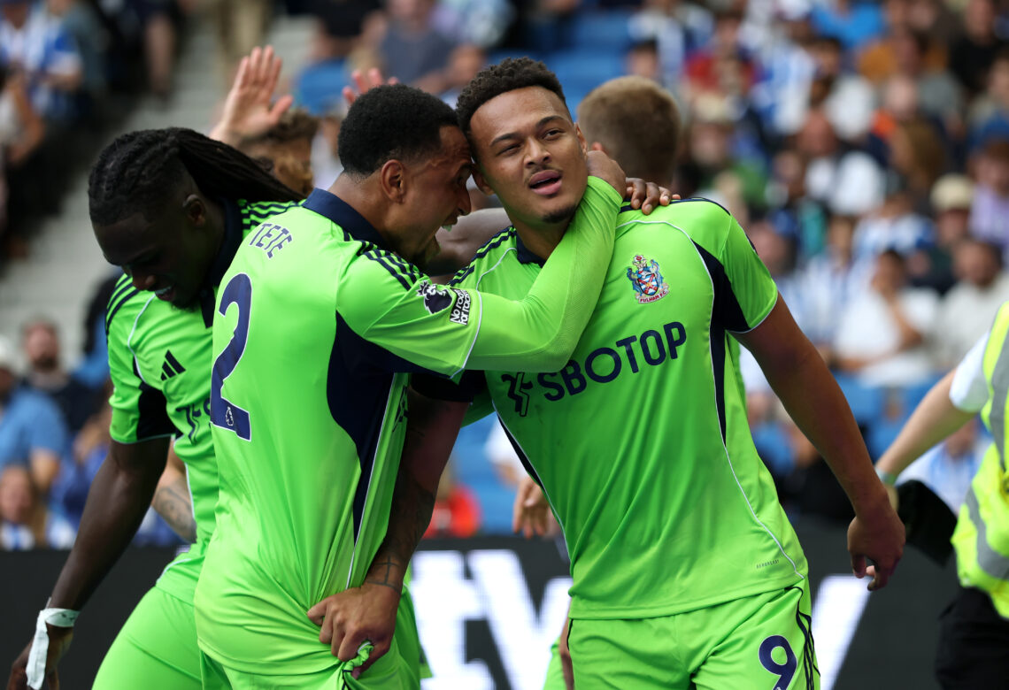 BRIGHTON, ENGLAND - AUGUST 16: Rodrigo Muniz of Fulham celebrates scoring his team's first goal with teammate Kenny Tete during the Premier League ...