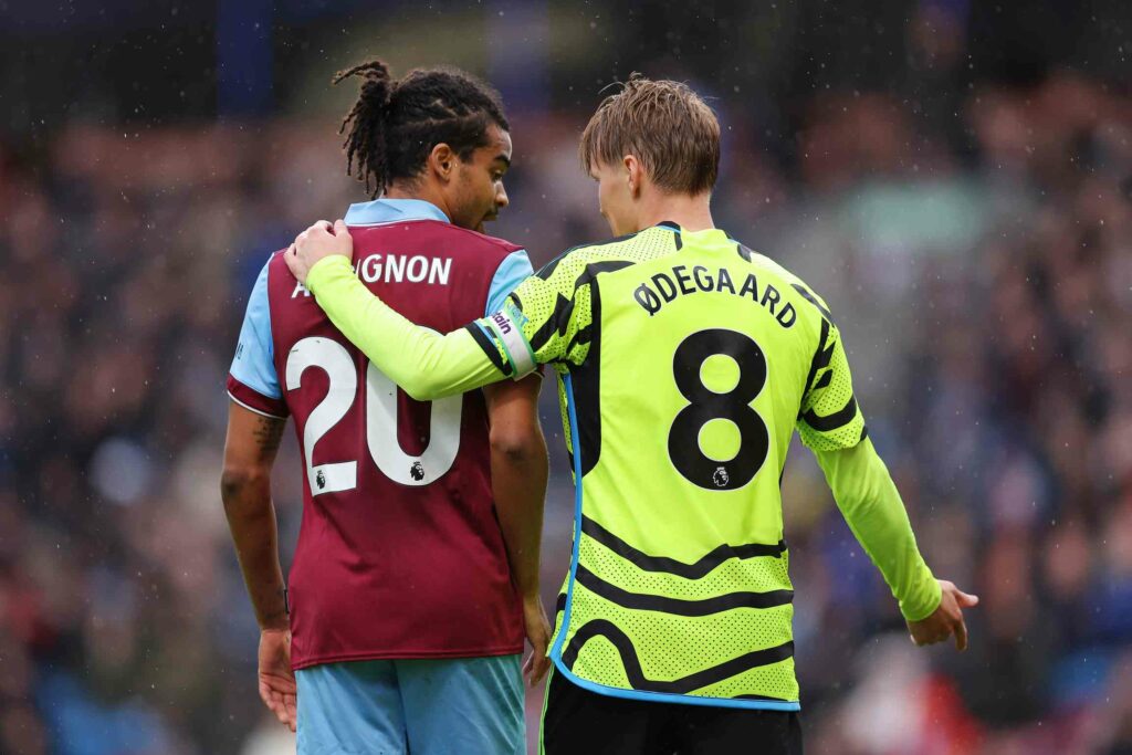 3 Burnley players injured ahead of Arsenal clash 2 BURNLEY, ENGLAND - FEBRUARY 17: Martin Odegaard of Arsenal puts his arm around Lorenz Assignon of Burnley during the Premier League match between Burnley FC and Arsenal FC at Turf Moor on February 17, 2024 in Burnley, England. (Photo by Matt McNulty/Getty Images)