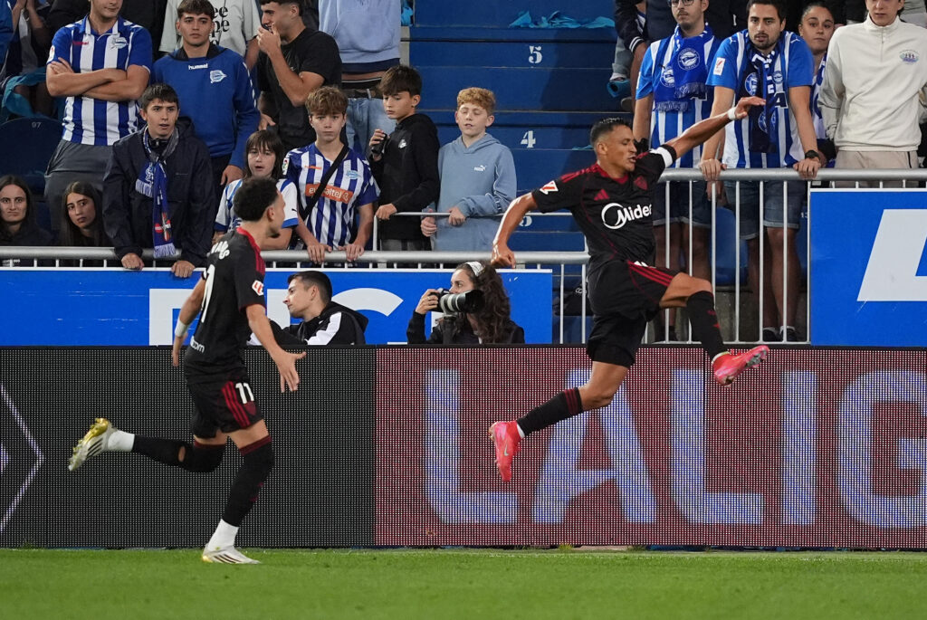 VITORIA-GASTEIZ, SPAIN - SEPTEMBER 20: Fans of Deportivo Alaves look dejected as Alexis Sanchez of Sevilla FC celebrates scoring his team's second goal during the LaLiga EA Sports match between Deportivo Alaves and Sevilla FC at Estadio de Mendizorroza on September 20, 2025 in Vitoria-Gasteiz, Spain. (Photo by Juan Manuel Serrano Arce/Getty Images)