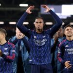 LONDON, ENGLAND - OCTOBER 18: Gabriel of Arsenal celebrates victory with teammates as he acknowledges the fans after the Premier League match between Fulham and Arsenal at Craven Cottage on October 18, 2025 in London, England. (Photo by Alex Pantling/Getty Images)