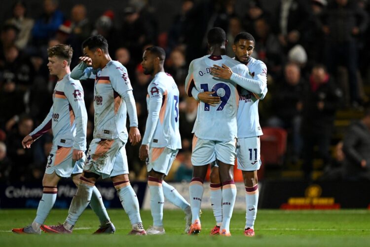 GRIMSBY, ENGLAND: Reiss Nelson of Brentford celebrates with teammate Dango Ouattara (obscured) after scoring his team's third goal during the Carab...