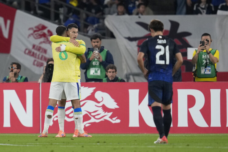 CHOFU, JAPAN: Gabriel Martinelli of Brazil (2nd) celebrates with Bruno Guimaraes (1st L) after scoring the team's second goal during the internatio...
