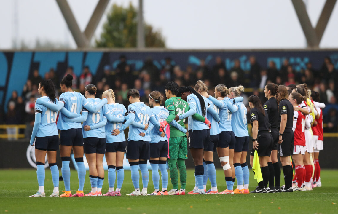 MANCHESTER, ENGLAND - OCTOBER 04: The match officials and players of Manchester City and Arsenal pause for a minutes' silence in honour of the vict...