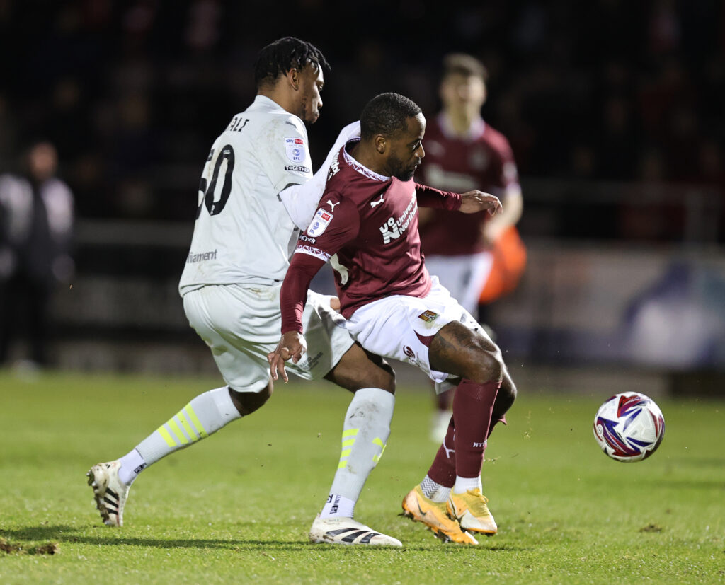 Former Arsenal youngster kicked out of 1st team 2 NORTHAMPTON, ENGLAND - FEBRUARY 25: Tariqe Fosu of Northampton Town attempts to control the ball under pressure from Kelechi Nwakali of Barnsley during the Sky Bet League One match between Northampton Town FC and Barnsley FC at Sixfields on February 25, 2025 in Northampton, England. (Photo by Pete Norton/Getty Images)