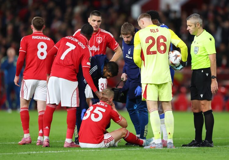 NOTTINGHAM, ENGLAND: Oleksandr Zinchenko of Nottingham Forest receives medical treatment during the UEFA Europa League 2025/26 League Phase MD3 mat...