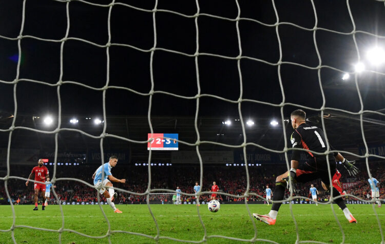 CARDIFF, WALES: Leandro Trossard of Belgium scores his team's fourth goal past Karl Darlow of Wales during the Group J FIFA World Cup 2026 qualifie...