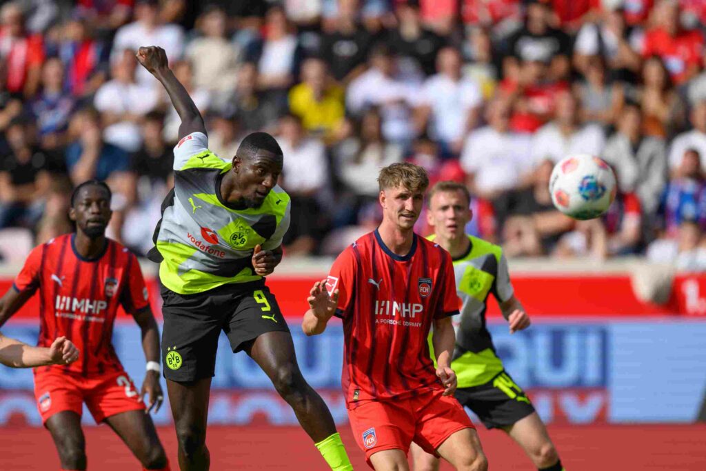 HEIDENHEIM, GERMANY - SEPTEMBER 13: Serhou Guirassy of Borussia Dortmund scores his team’s first goal during the Bundesliga match between 1. FC Heidenheim 1846 and Borussia Dortmund at Voith-Arena on September 13, 2025 in Heidenheim, Germany. (Photo by Christian Kaspar-Bartke/Getty Images)