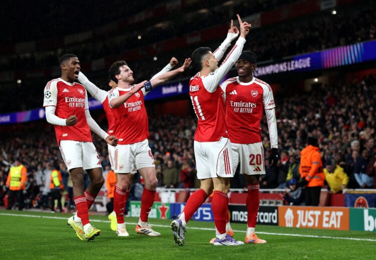 LONDON, ENGLAND: Gabriel Martinelli of Arsenal celebrates scoring his team's third goal with teammates during the UEFA Champions League 2025/26 Lea...