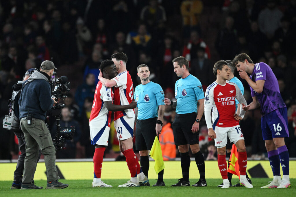 LONDON, ENGLAND - APRIL 01: Bukayo Saka of Arsenal embraces team mate Declan Rice after the Premier League match between Arsenal FC and Fulham FC at Emirates Stadium on April 01, 2025 in London, England. (Photo by Justin Setterfield/Getty Images)