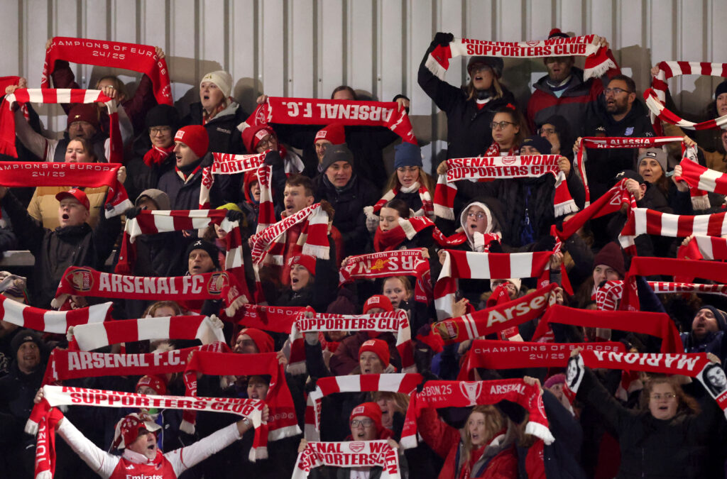 BOREHAMWOOD, ENGLAND - NOVEMBER 19: Arsenal fans hold up scarves in support prior to the UEFA Women's Champions League 2025/26 league phase match between Arsenal FC and Real Madrid CF at Meadow Park on November 19, 2025 in Borehamwood, England. (Photo by Julian Finney/Getty Images)