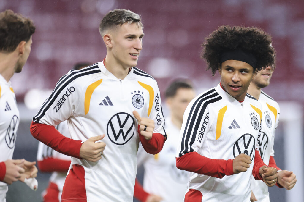 23yo winger tells Man United he wants Arsenal 3 LEIPZIG, GERMANY - NOVEMBER 16: Nico Schlotterbeck and Karim Adeyemi of Germany run during a training session on November 16, 2025 in Leipzig, Germany. Germany is playing against Slovakia in FIFA World Cup 2026 qualifer game on November 17, 2025. (Photo by Maja Hitij/Getty Images)