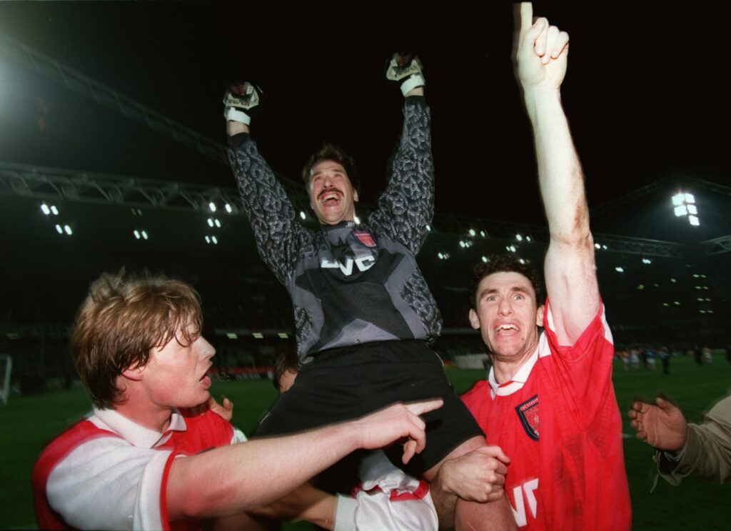 20 APR 1995: MAN OF THE MATCH ARSENAL GOALKEEPER DAVID SEAMAN (CENTRE) CELEBRATES WITH TEAM MATES STEFAN SCHWARZ (LEFT) AND MARTIN KEOWN AFTER ARSENALS VICTORY OVER SAMPDORIA IN THE EUROPEAN CUP WINNERS CUP SEMI FINAL SECOND LEG MATCH IN GENOA, ITALY.ARSENAL WON THE MATCH AFTER A PENALTY SHOOT OUT. Mandatory Credit: Gary M. Prior/ALLSPORT