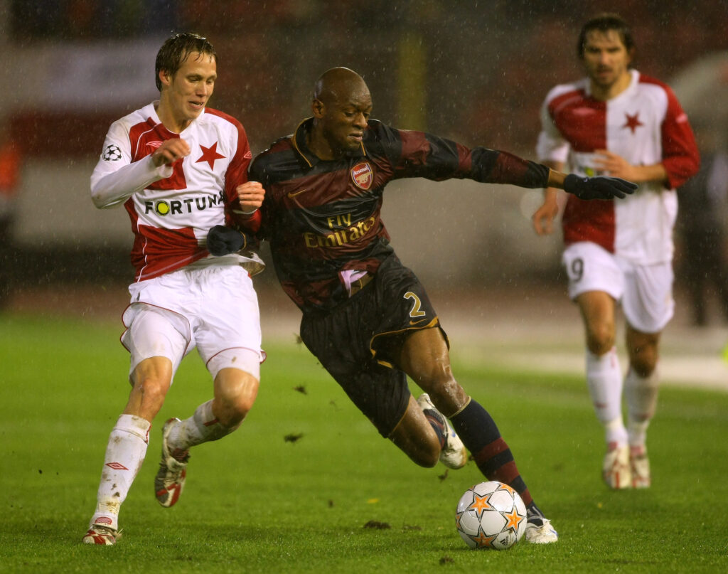 PRAGUE, CZECH REPUBLIC - NOVEMBER 07: Abou Diaby of Arsenal holds off a challenge from Michal Svec of Slavia Prague during the UEFA Champions League Group H match between SK Slavia Prague and Arsenal, at the Evzena Rosickeho Strahov Stadium on November 7, 2007, in Prague, Czech Republic. (Photo by Clive Mason/Getty Images)