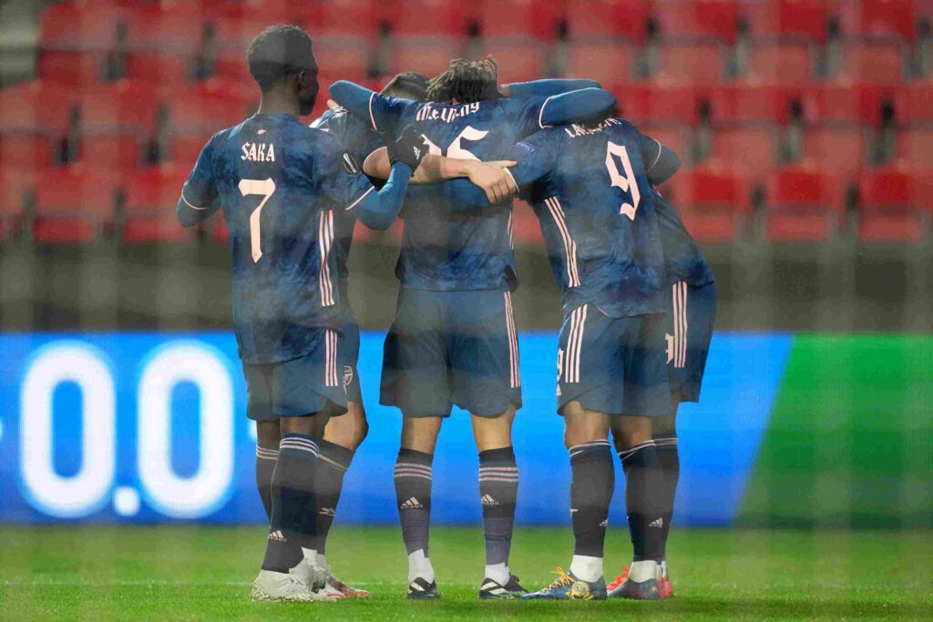 PRAGUE, CZECH REPUBLIC - APRIL 15: Alexandre Lacazette of Arsenal celebrates with teammates after scoring their team's fourth goal during the UEFA Europa League Quarter Final Second Leg match between Slavia Praha and Arsenal FC at Sinobo Stadium on April 15, 2021 in Prague, Czech Republic. Sporting stadiums around Europe remain under strict restrictions due to the Coronavirus Pandemic as Government social distancing laws prohibit fans inside venues resulting in games being played behind closed doors. (Photo by Martin Sidorjak/Getty Images)