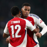 LISBON, PORTUGAL - NOVEMBER 26: Gabriel of Arsenal celebrates victory with teammate Jurrien Timber after the UEFA Champions League 2024/25 League Phase MD5 match between Sporting Clube de Portugal and Arsenal FC at Estadio Jose Alvalade on November 26, 2024 in Lisbon, Portugal. (Photo by Alex Pantling/Getty Images)