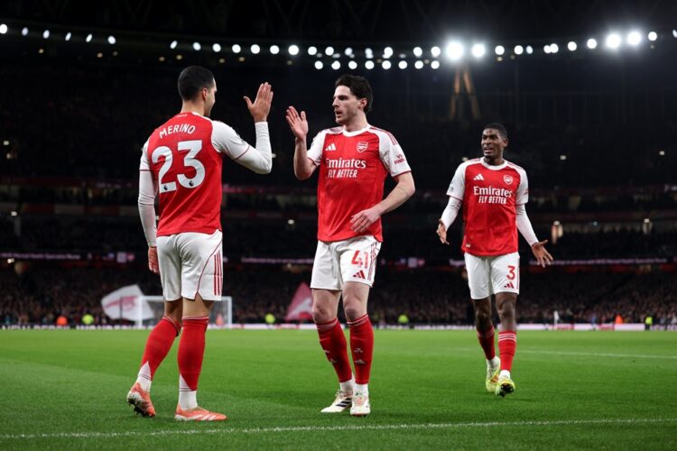 LONDON, ENGLAND: Mikel Merino of Arsenal celebrates scoring his team's first goal with teammate Declan Rice during the Premier League match between...