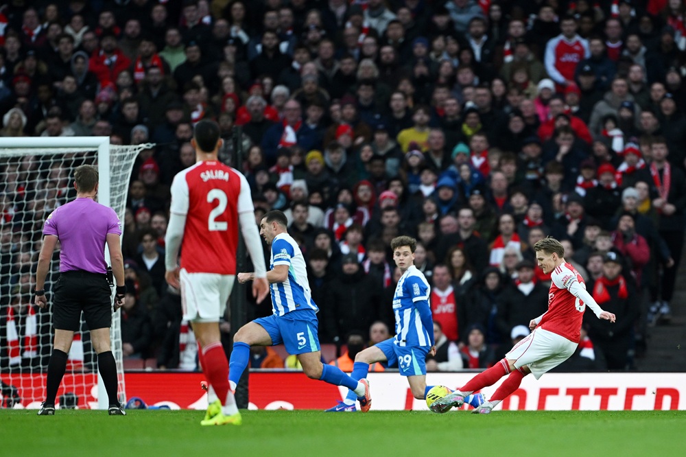 Martin Odegaard of Arsenal scores his team's first goal during the Premier League match between Arsenal and Brighton & Hove Albion at the Emirates Stadium on December 27, 2025 in London, England. (Photo by Shaun Botterill/Getty Images)