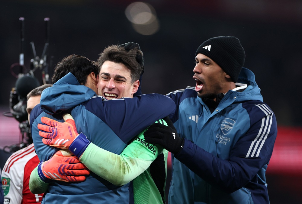 Kepa Arrizabalaga of Arsenal is congratulated by his teammates following victory in the Carabao Cup Quarter Final match between Arsenal and Crystal...