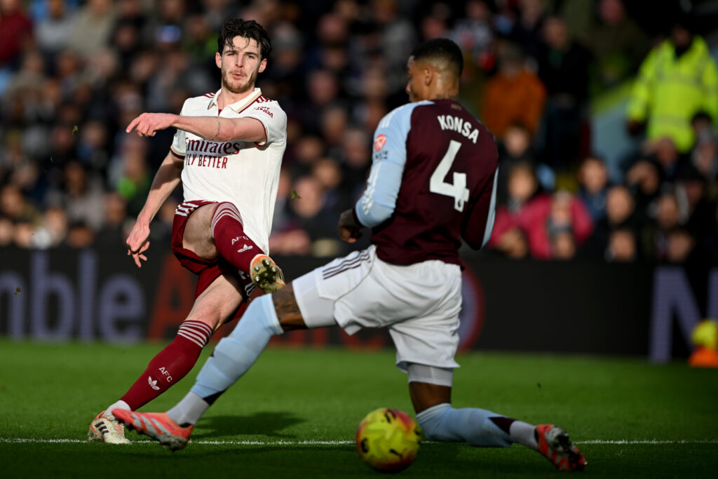 Declan Rice misses training ahead of Club Brugge, Dowman injured 2 BIRMINGHAM, ENGLAND - DECEMBER 06: Declan Rice of Arsenal shoots past Ezri Konsa of Aston Villa during the Premier League match between Aston Villa and Arsenal at Villa Park on December 06, 2025 in Birmingham, England. (Photo by Shaun Botterill/Getty Images)