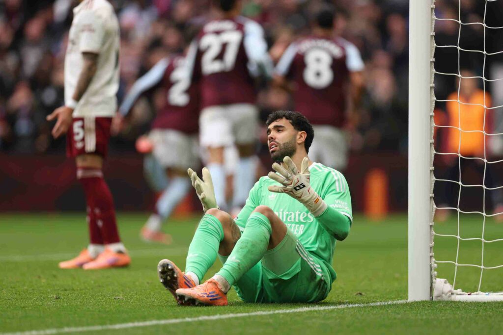 BIRMINGHAM, ENGLAND - DECEMBER 06: David Raya of Arsenal reacts after Matty Cash of Aston Villa scores his sides first goal during the Premier League match between Aston Villa and Arsenal at Villa Park on December 06, 2025 in Birmingham, England. (Photo by Alex Pantling/Getty Images)